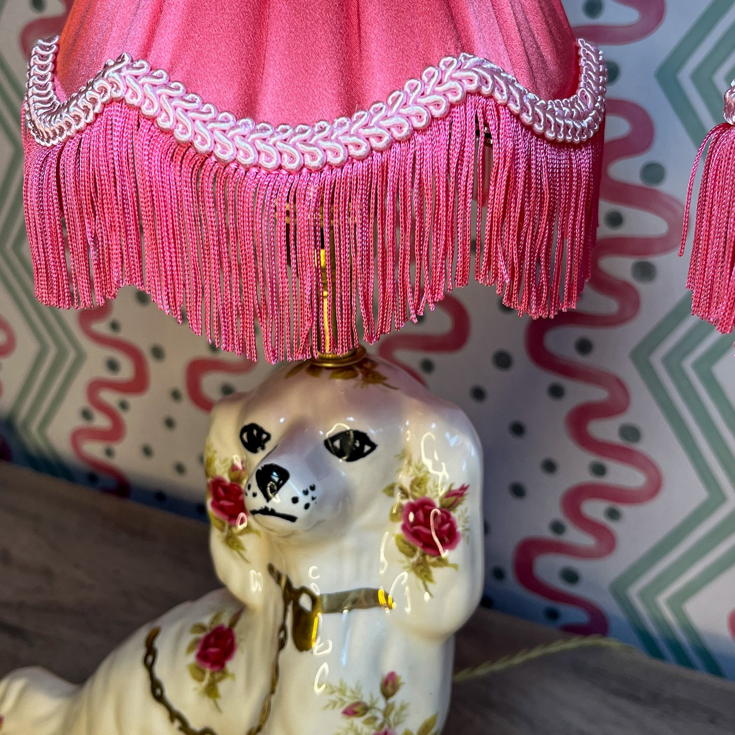 Pair of floral Staffordshire dog lamps with coral shades