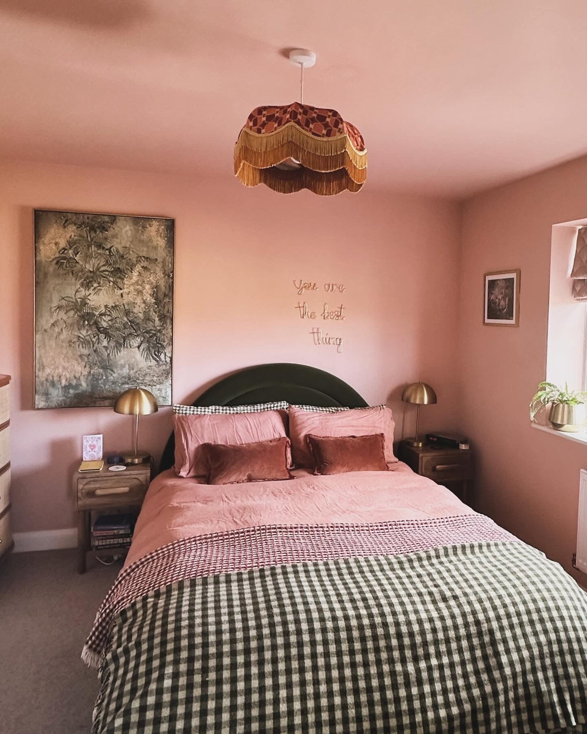 Tiered fringed pendant shade in a pink bedroom